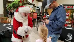 The Chico Mall Santa talks to a child during a holiday event.
