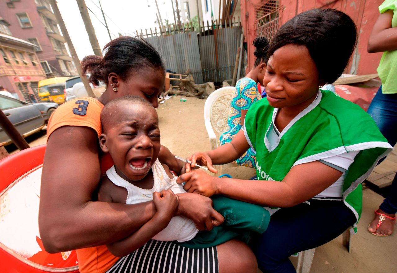 A young boy reacts as a health worker administers a measles vaccine in Lagos. Nigeria is one of three countries where up to about 8.1 million children remain un-vaccinated from measles, according to the <a href="http://www.who.int/news-room/fact-sheets/detail/measles" target="_blank" target="_blank">World Health Organization</a>.