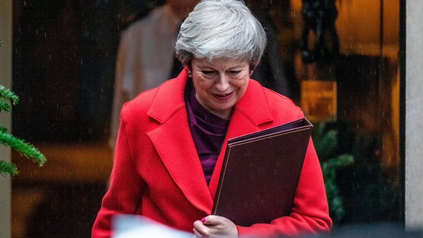 LONDON, ENGLAND - DECEMBER 03: British Prime Minister Theresa May leaves Downing Street in the rain to address the House of Commons since her return from the G20 summit on December 3, 2018 in London, England. Members of Parliament will vote on the Brexit deal Ms May has reach with the European Union on December 11. (Photo by Dan Kitwood/Getty Images)
