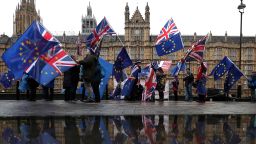 Pro-European Union (EU), anti-Brexit demonstrators wave Union and EU flags as they protest opposite the Houses of Parliament in London on December 3, 2018. - Britain's Prime Minister Theresa May said last week it was up to MPs to decide whether Britain leaves the European Union next March with no deal despite the potentially catastrophic impact. (Photo by Daniel LEAL-OLIVAS / AFP)        (Photo credit should read DANIEL LEAL-OLIVAS/AFP/Getty Images)
