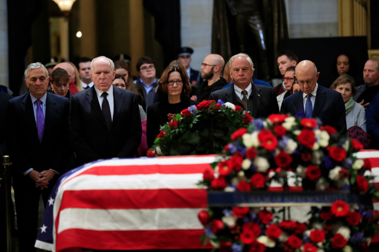 CIA Director Gina Haspel and former CIA directors -- from left, George Tenet, John Brennan, Porter Goss and James Woolsey -- say goodbye to Bush on December 4. Bush was director of Central Intelligence in the late 1970s.