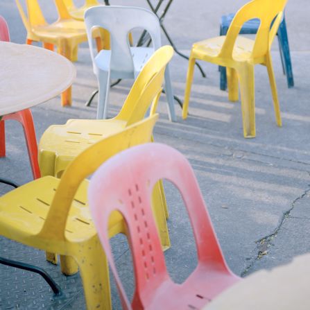 Another recurring motif in Nguan's photos is the colorful plastic chairs commonly seen at hawker centers, religious festivals, weddings and funerals.