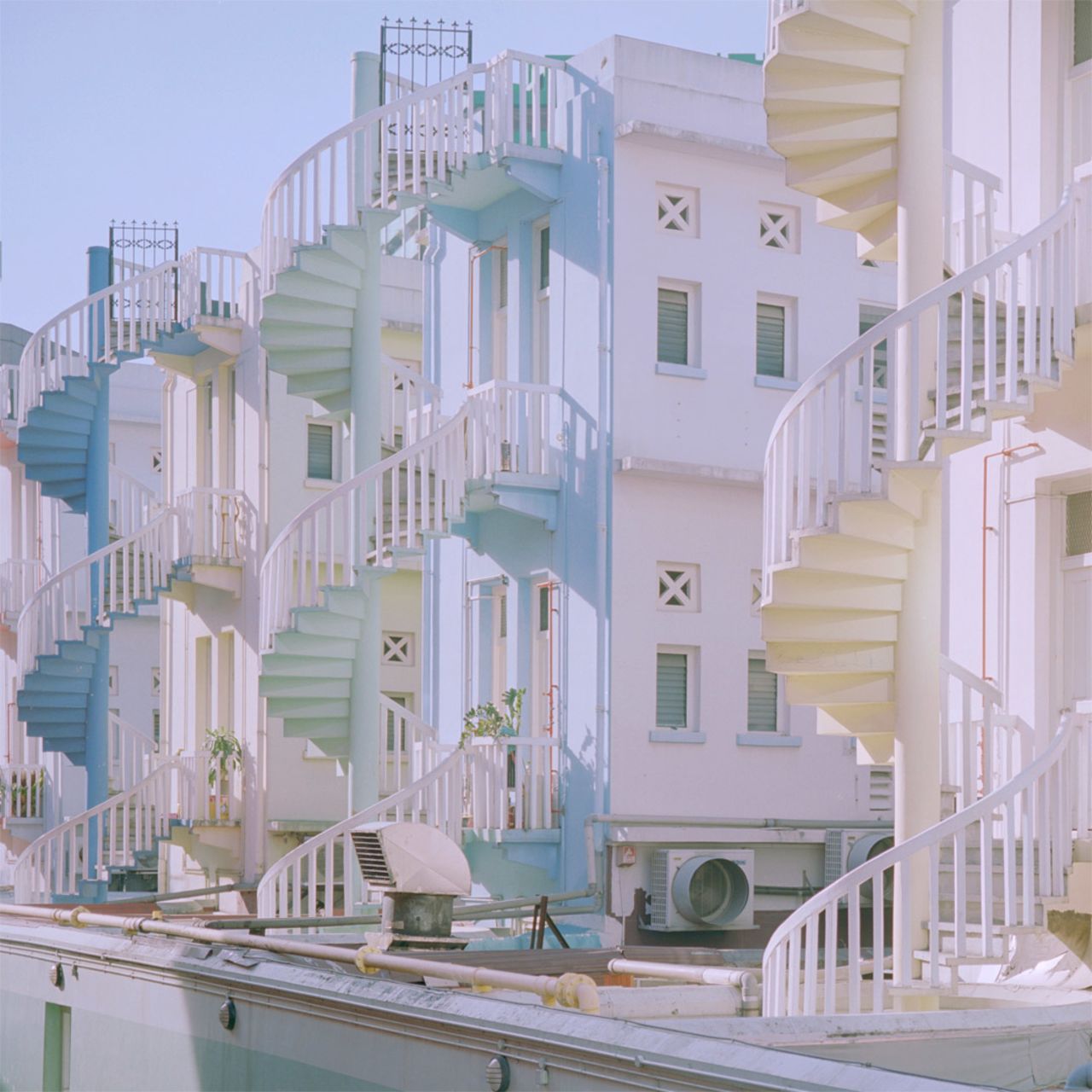 Nguan often captures the spiral stairacases found at the back of Singapore's shophouses.