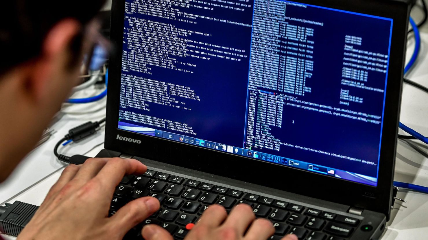 A person works at a computer during the 10th International Cybersecurity Forum in Lille on January 23, 2018.