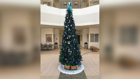 The tree features many green decorations because green has become a symbol to raise awareness of missing children.