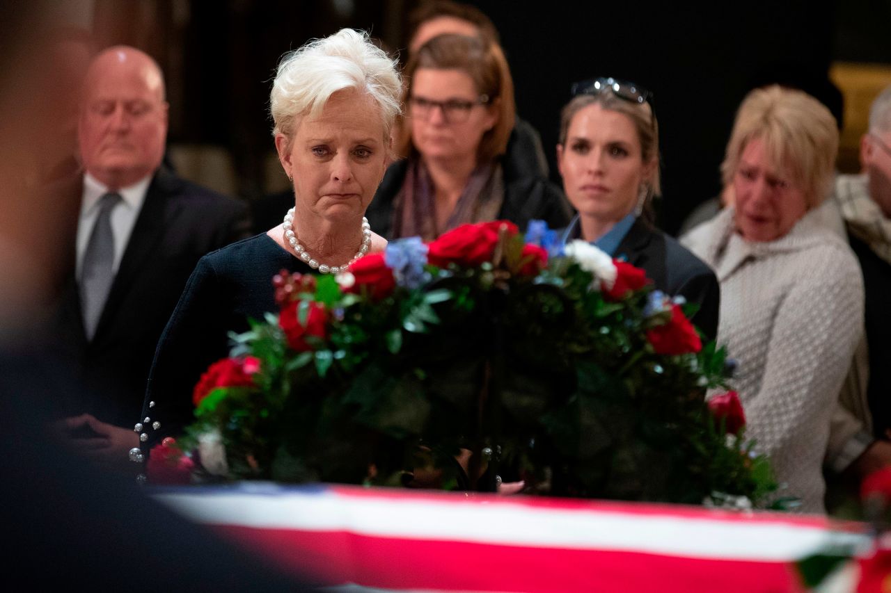 Cindy McCain, widow of the late US Sen. John McCain, stops by Bush's casket.