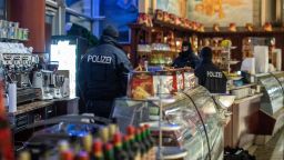 05 December 2018, North Rhine-Westphalia, Duisburg: Policemen are standing in an ice cream parlour in the Citypalais in downtown Duisburg. Investigators in Germany, Italy, the Netherlands and Belgium have raided members of the Italian mafia organisation 'Ndrangheta. Photo: Christoph Reichwein/dpa (Photo by Christoph Reichwein/picture alliance via Getty Images)