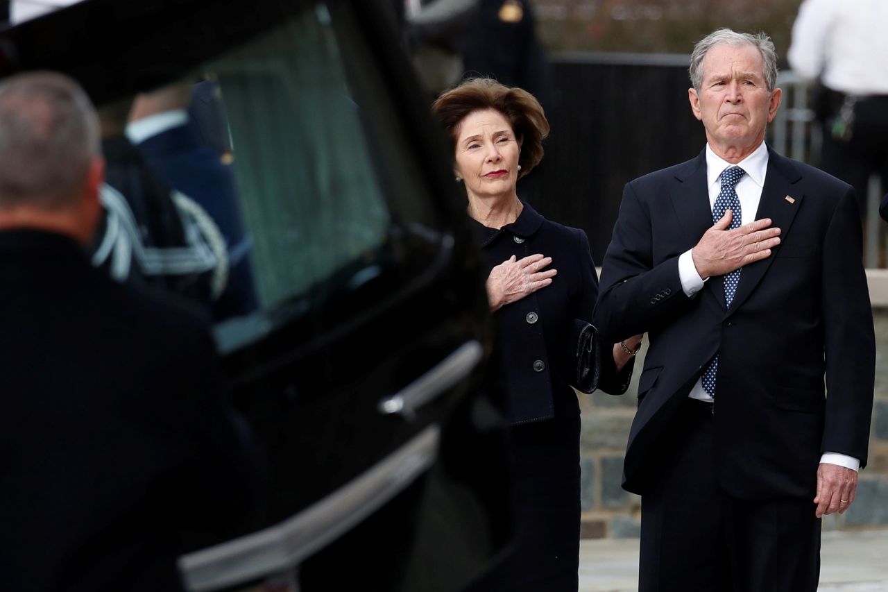 George W. Bush and his wife, Laura, attend the state funeral.