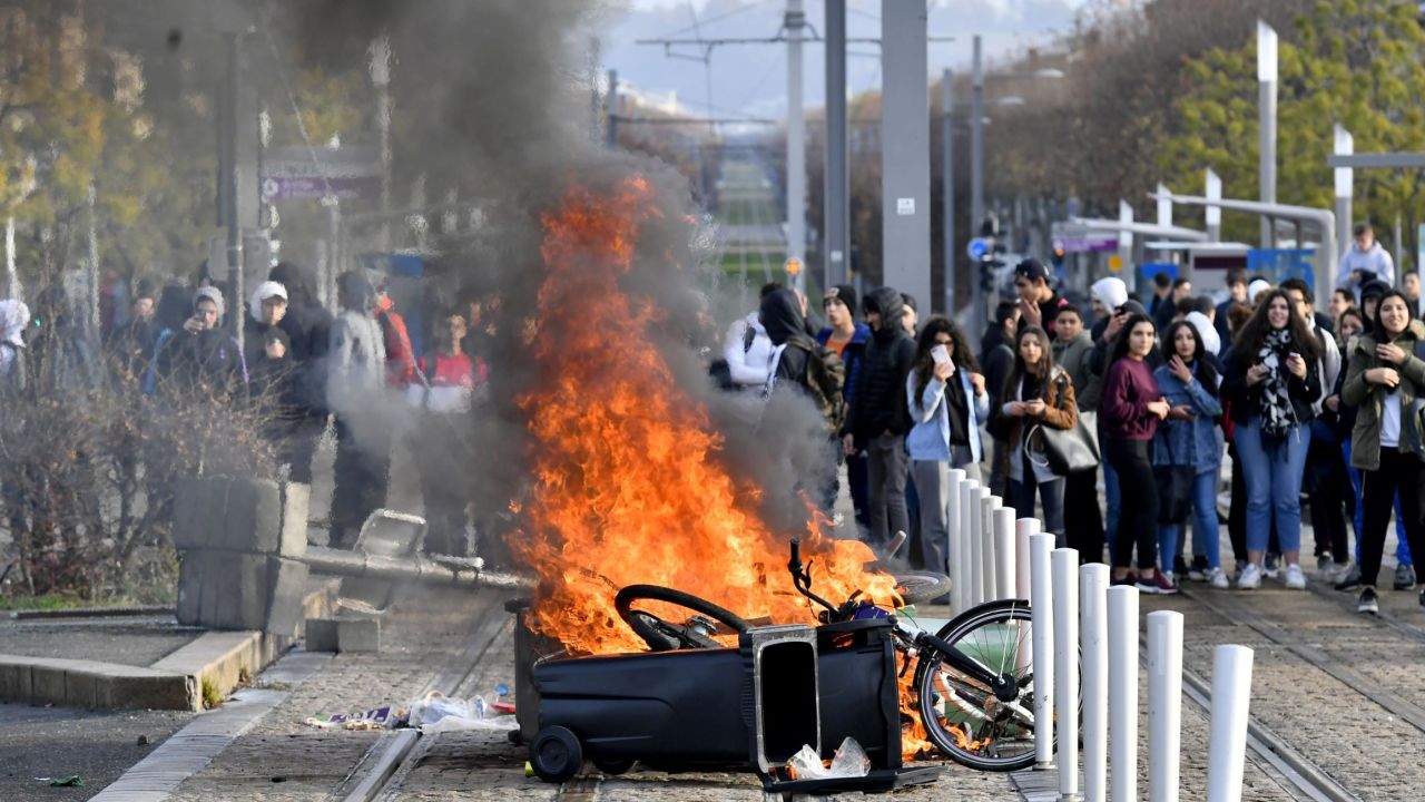 High schoolers set a barricade on fire to block a tramway during a protest Wednesday in Bordeaux.