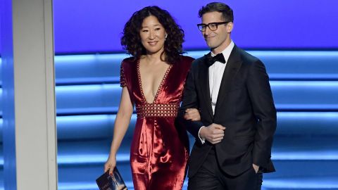 LOS ANGELES, CA - SEPTEMBER 17:  Sandra Oh (L) and Andy Samberg walk onstage during the 70th Emmy Awards at Microsoft Theater on September 17, 2018 in Los Angeles, California.  (Photo by Kevin Winter/Getty Images)