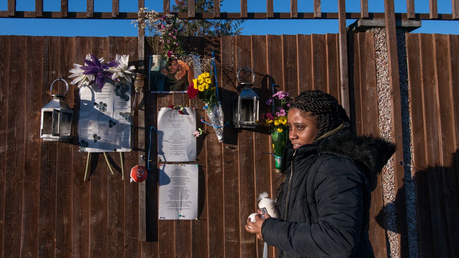 Tilisha Goupall tends a memorial to her younger brother, Jermaine Goupall, at the location where he was stabbed to death in south London in August 2017.