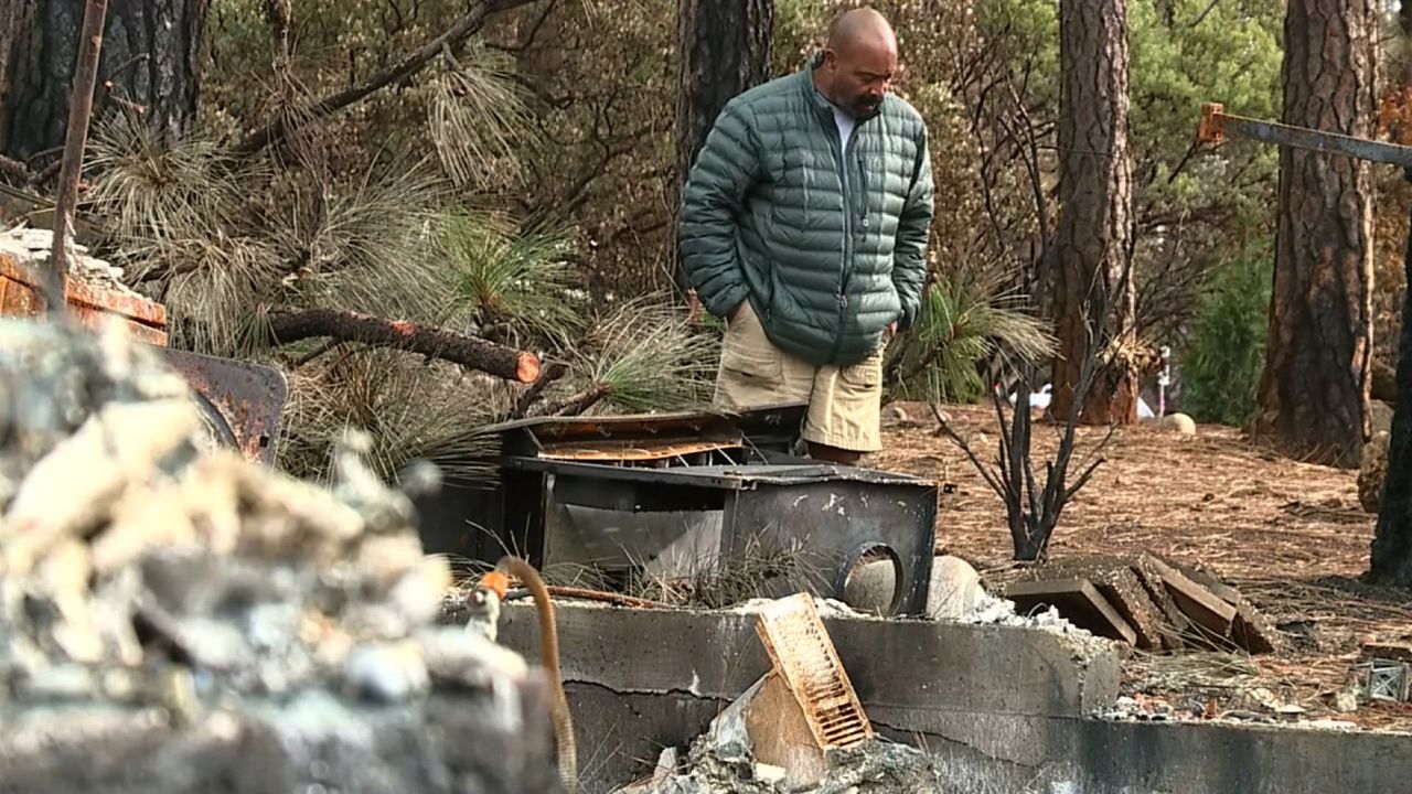 Omar Franklin walks around the site where his home once stood in Paradise, California, in December, 2018.