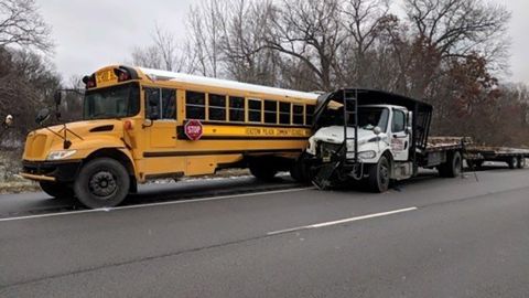 An Indiana school bus was hit by a truck Wednesday on the way to a Christmas musical, police say.