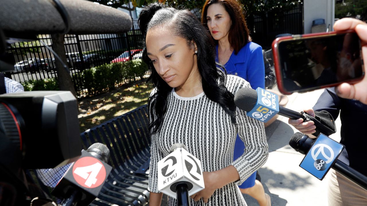Elissa Ennis, former girlfriend of San Francisco 49ers linebacker Reuben Foster, center, walks out of Santa Clara County Superior Court with her attorney Stephanie Rickard, rear, after testifying in Foster's preliminary hearing, Thursday, May 17, 2018, in San Jose, Calif. Foster pleaded not guilty Tuesday, May 8, 2018, to charges stemming from allegations that he attacked Ennis in their home in February. (AP Photo/Marcio Jose Sanchez)