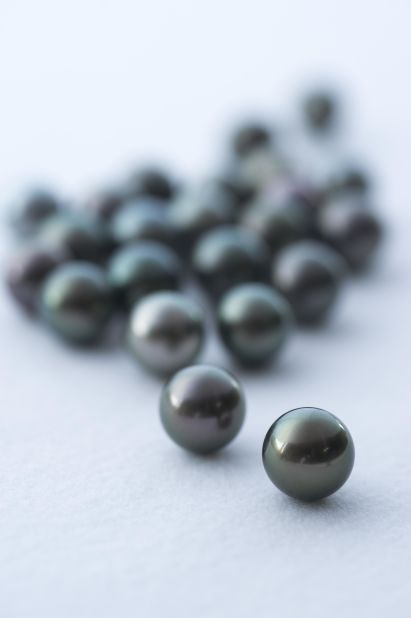 Pearls occur naturally when an outside agent -- sand or a bone fragment, for instance -- becomes lodged inside a mollusk. 