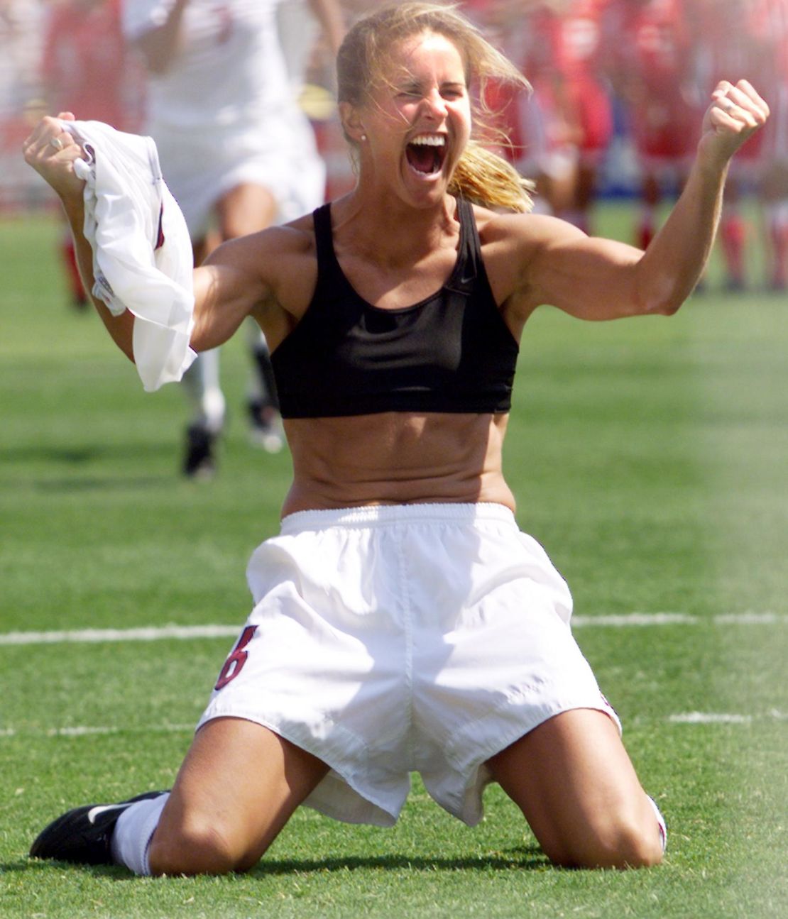 Brandi Chastain shouts after scoring the winning penalty kick in the 1999 Women's World Cup final. The victory was a pivotal moment for US women's soccer.