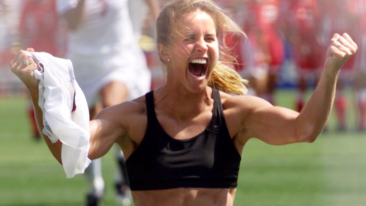 Brandi Chastain shouts after scoring the winning penalty kick in the 1999 Women's World Cup final. The victory was a pivotal moment for US women's soccer.