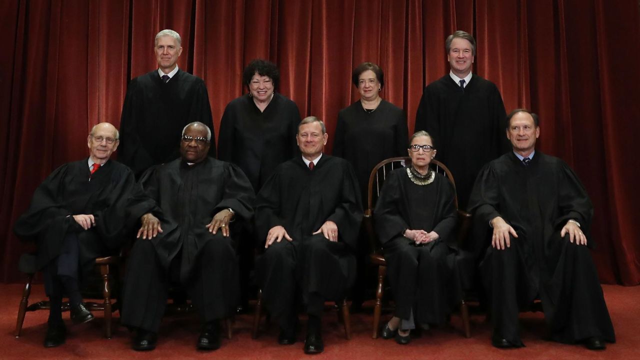 WASHINGTON, DC - NOVEMBER 30: United States Supreme Court Justices pose for their official portrait at the in the East Conference Room at the Supreme Court.
