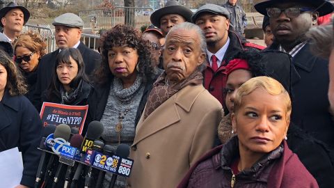 Eric Garner's mother, Gwen Carr, center, with the Rev. Al Sharpton and others after a disciplinary hearing for Daniel Pantaleo.