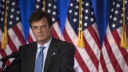 FILE: Paul Manafort, a Trump campaign worker, stands on stage before Donald Trump, presumptive Republican presidential candidate, speaks during a primary night event at the Trump National Golf Club Westchester in Briarcliff Manor, New York, U.S., on Tuesday, June 7, 2016. Manafort, a former campaign manager for President Donald Trump, and his onetime business partner Rick Gates were charged with conspiracy against the U.S., the first people charged in the broad investigation into Russian meddling with the U.S. election. Photographer: Victor Blue/Bloomberg via Getty Images