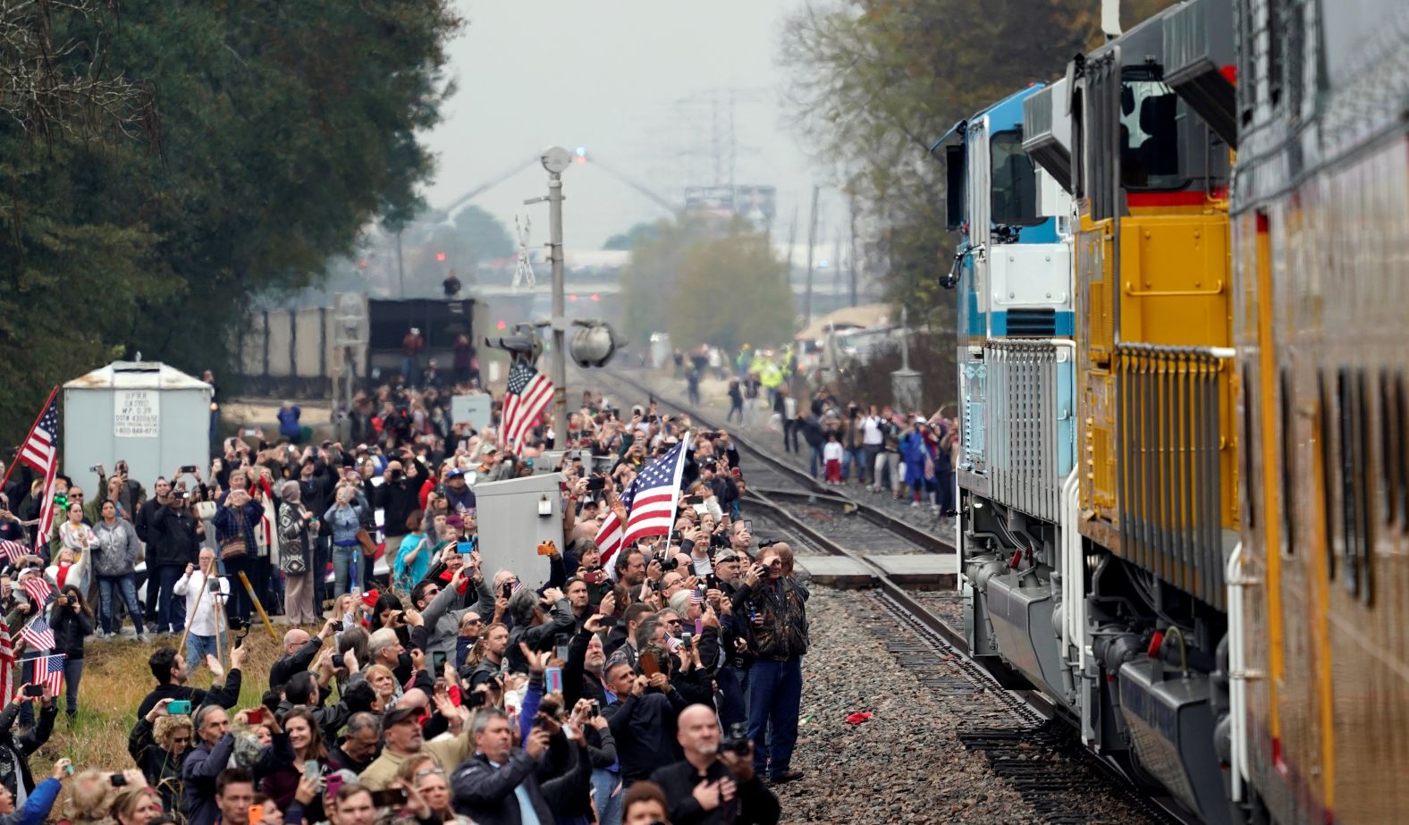 People line the train route to say goodbye to the former President.