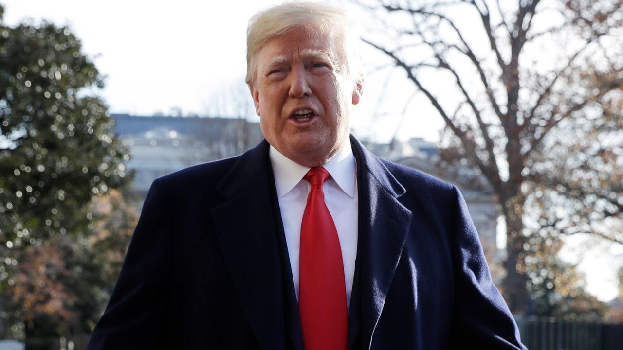 President Donald Trump talks with reporters before departing for Kansas City to address the 2018 Project Safe Neighborhoods National Conference, on the South Lawn of the White House, Friday, Dec. 7, 2018, in Washington. (AP Photo/Evan Vucci)