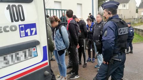 Police detain students Thursday in Mantes-la-Jolie after clashes with security forces.