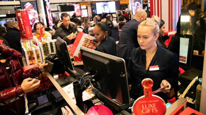 Employees serve customers at the Macy's Inc. flagship store in New York, U.S., on Thursday, Nov. 22, 2018. Deloitte expects sales from November to January to rise as much as 5.6 percent, to more than $1.1 trillion, marking the best holiday period in recent memory. Photographer: Jeenah Moon/Bloomberg via Getty Images
