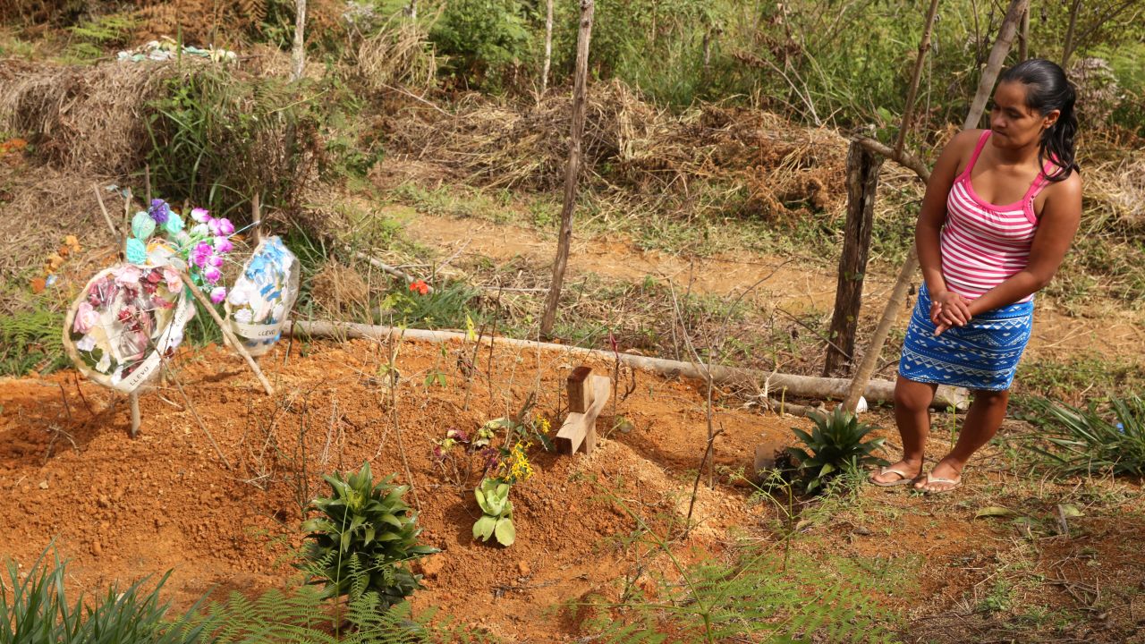 Delmi Amparo Hernández buried her husband in the earth he used to till.