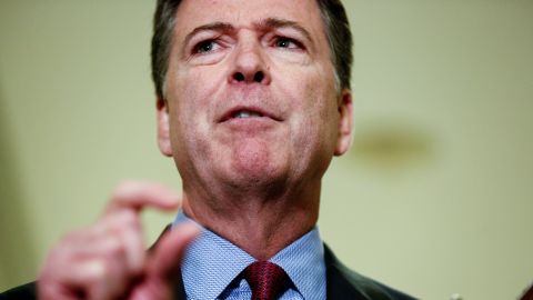 Former FBI Director James Comey speaks to the media after giving a private deposition to the House Judiciary and House Government and Oversight committees on Capitol Hill in Washington on Friday, December 7, 2018.