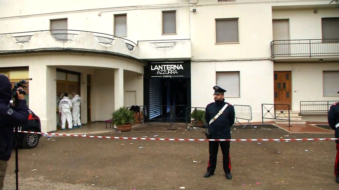 Forensic teams and police cordon off the Lanterna Azzurra club's entrance Saturday in Corinaldo.