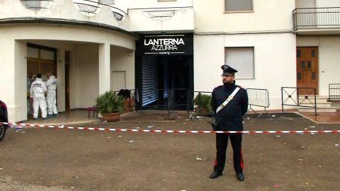 Forensic teams and police cordon off the Lanterna Azzurra club's entrance Saturday in Corinaldo.