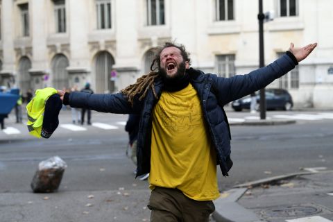 A protester reacts during clashes with police on December 8 in Paris.