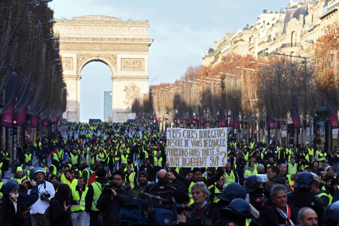 Protesters gather near the Arc de Triomphe Saturday in the French capital.