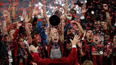 Atlanta United celebrates with the MLS Cup after their 2-0 win over the Portland Timbers at Mercedes-Benz Stadium.