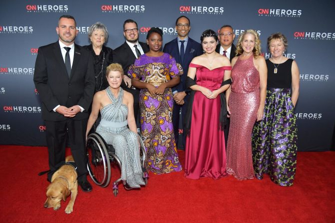 The 2018 Top 10 CNN Heroes arrive on the red carpet. From left to right are Chris Stout, Florence Phillips, Amanda Boxtel, Luke Mickelson, Abisoye Ajayi-Akinfolarin, Dr. Rob Gore, Maria Rose Belding, Dr. Ricardo Pun-Chong, Susan Munsey, and Ellen Stackable.