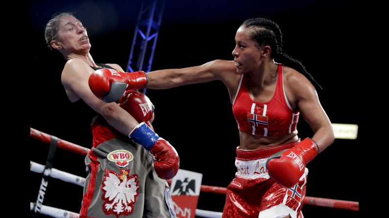 Norway's Cecilia Braekhus, right, hits Aleksandra  Magdziak-Lopes during a boxing match on Saturday, December 8, in Carson, California.
