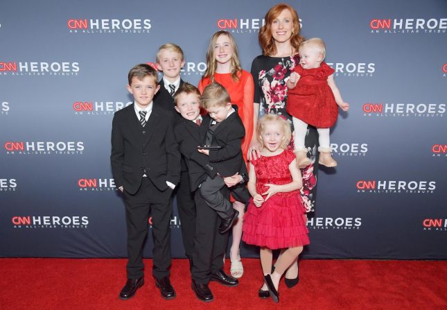 Jennie Taylor, center, and her children Lincoln, Alexander, Jacob, Jonathan, Eleanor, Caroline and Megan Taylor attend the 12th annual "CNN Heroes: An All-Star Tribute." Jennie is the wife of National Guard Maj. Brent Taylor, the mayor of North Ogden, Utah, who was killed in Afghanistan on November 3. 