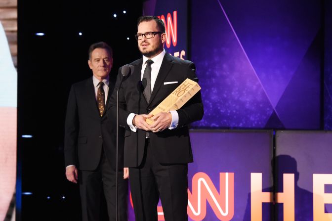 Top 10 CNN Hero Luke Mickelson accepts his award from actor Bryan Cranston, left, onstage during the 12th annual "CNN Heroes: An All-Star Tribute."