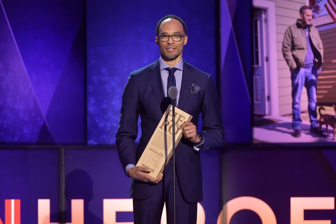 Top 10 CNN Hero Dr. Rob Gore accepts his award. Dr. Gore created Kings Against Violence Initiative, an organization that hosts anti-violence programs at Kings County hospital, local schools and the broader Brooklyn, New York community. 