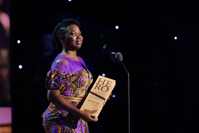 Top 10 CNN Hero Abisoye Ajayi-Akinfolarin accepts her award onstage. Ajayi-Akinfolarin teaches computer programming to girls in Lagos, Nigeria, where Facebook and Google opened offices earlier in 2018.