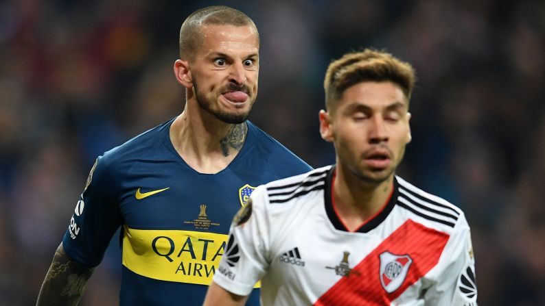 Dario Benedetto of Boca Juniors makes a face at Gonzalo Montiel of River Plate to celebrate scoring his team's first goal in the final match of Copa CONMEBOL Libertadores 2018 on Sunday, December 9 in Madrid, Spain.