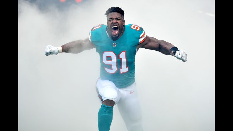 Miami Dolphins defensive end Cameron Wake reacts during player introductions prior to the game against the Buffalo Bills on Sunday, December 2 in Miami Gardens, Florida.
