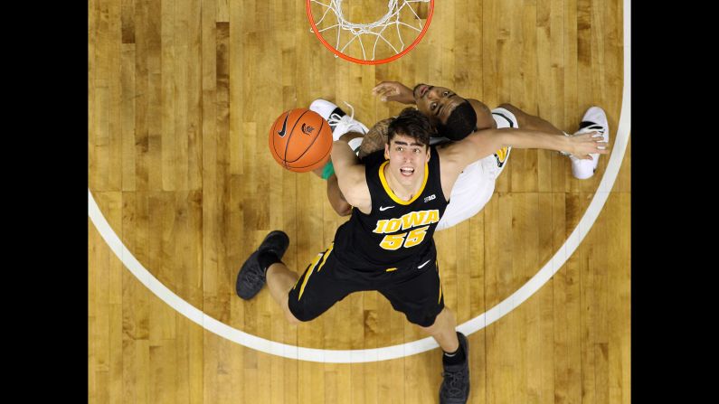 Nick Ward of the Michigan State Spartans and Luka Garza of the Iowa Hawkeyes fight for position during the second half of a game on Monday, December 3 in East Lansing, Michigan. 