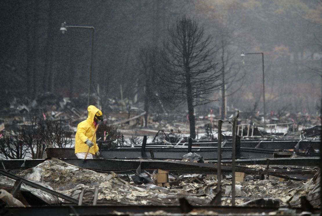 A search and rescue crew member searches for human remains at a mobile home park in Paradise which was destroyed on November 21, 2018. 