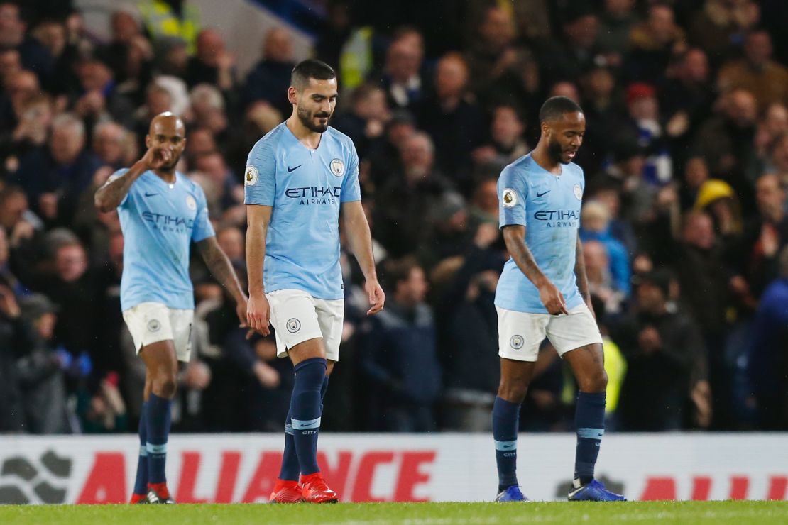 Manchester City midfielders Fabian Delph, Ilkay Gundogan and Raheem Sterling react after Chelsea scores its second goal.