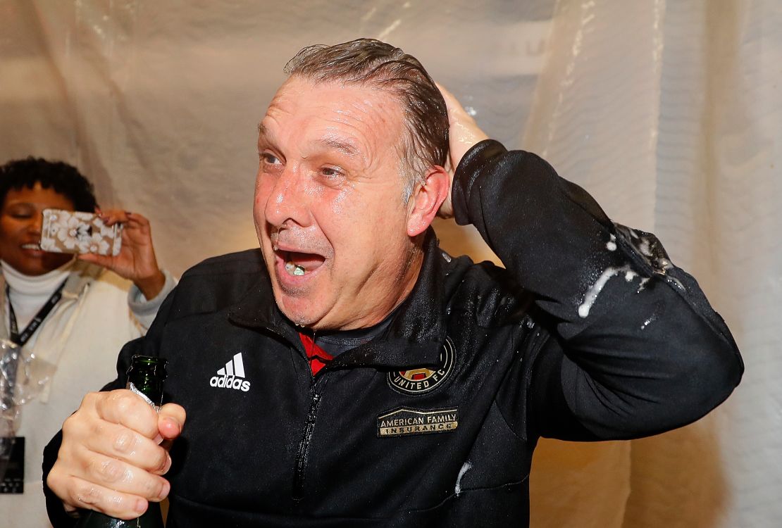 Atlanta coach Gerardo "Tata" Martino, post-champagne shower.