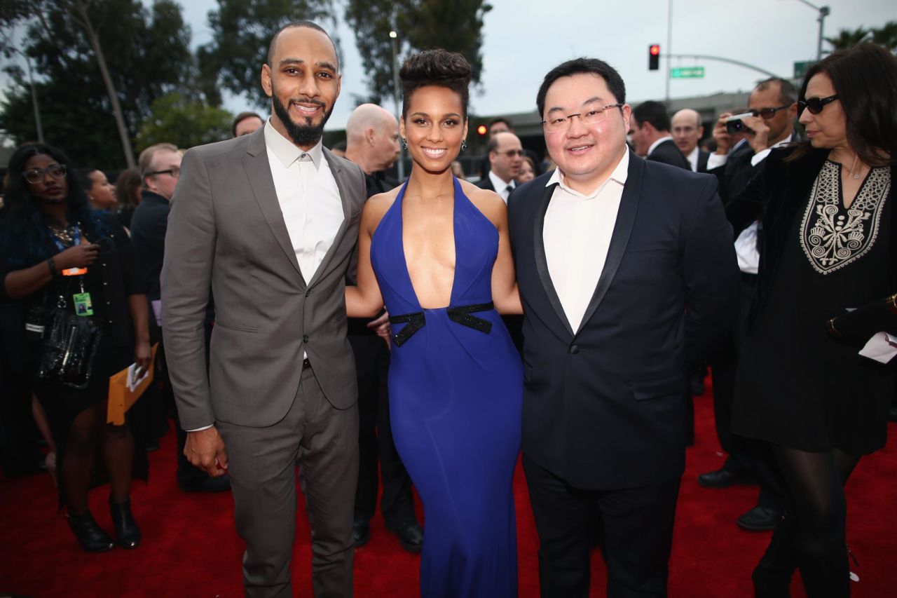 LOS ANGELES, CA - JANUARY 26:  (L-R) Producer Swizz Beatz, recording artist Alicia Keys and Owner, EMI Music Publishing and Chairman EMI Music Publishing Asia Jho Low attend the 56th GRAMMY Awards at Staples Center on January 26, 2014 in Los Angeles, California.  (Photo by Christopher Polk/Getty Images for NARAS)