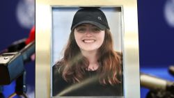 AUCKLAND, NEW ZEALAND - DECEMBER 07: A photo of missing British woman Grace Millane is displayed ahead of a press conference on December 07, 2018 in Auckland, New Zealand. Police are investigating the disappearance of 22-year-old British woman Grace Millane after last been seen on Saturday December 1 in Auckland.  (Photo by Hannah Peters/Getty Images)