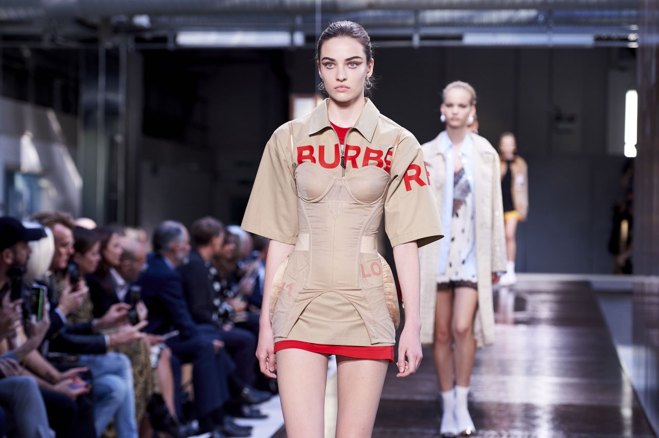 A model walks in Burberry during a show for the Spring/Summer 2019 collection at London Fashion Week on September 17, 2018. The fashion label said it would ban its practice of destroying unsold products.